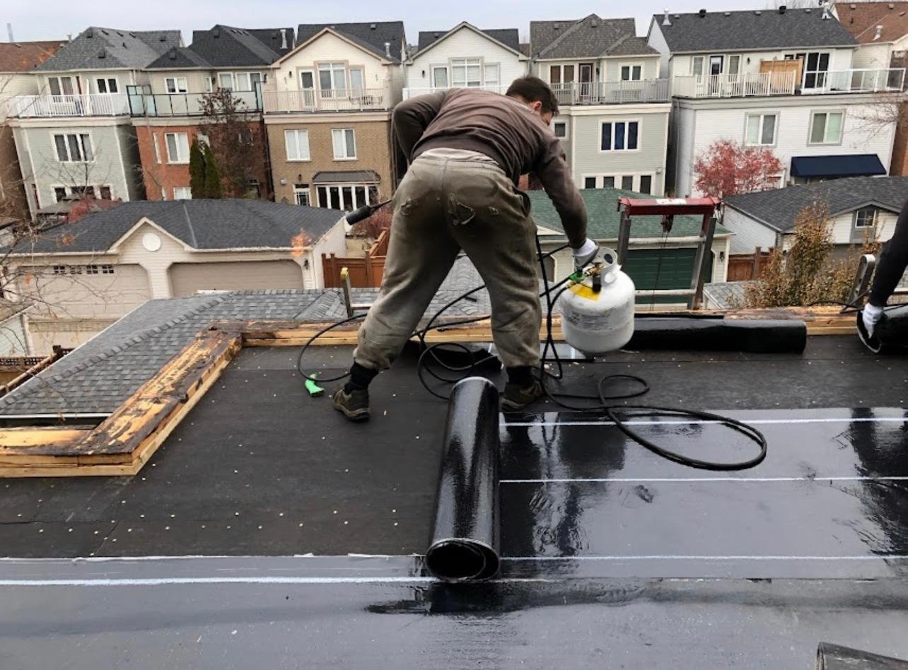 Flat roof torch-down installation