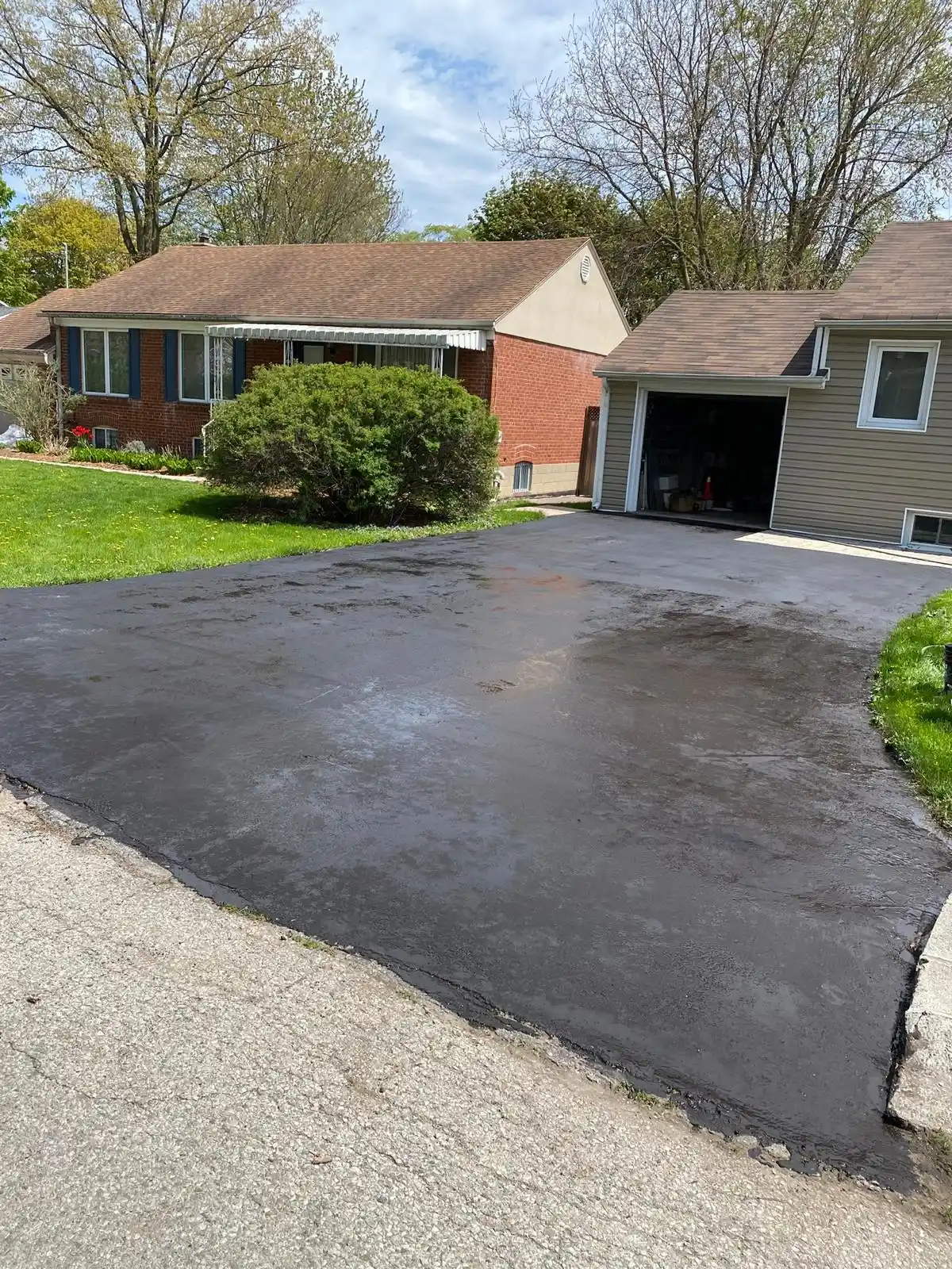 New asphalt driveway after