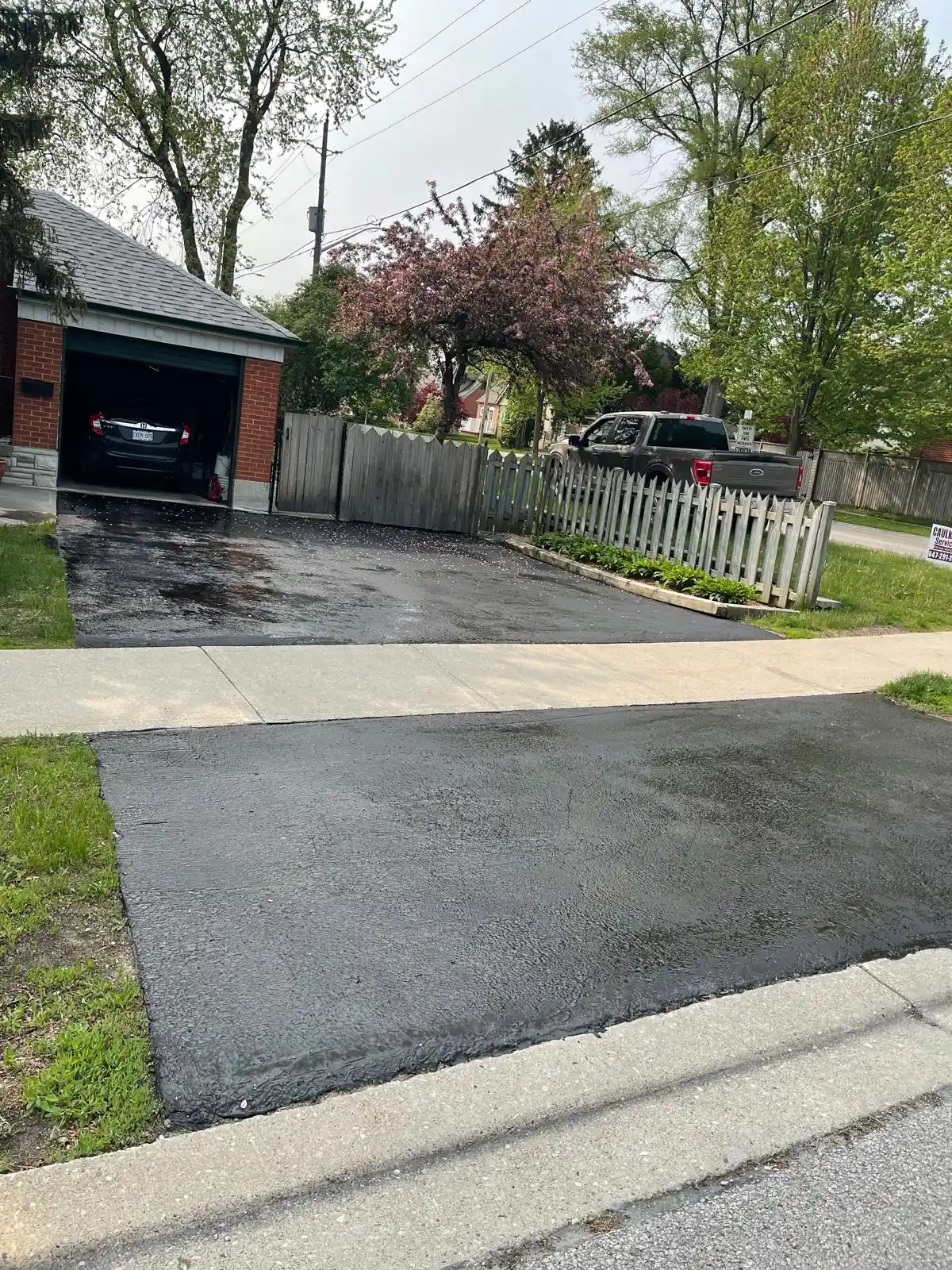 New asphalt driveway and walkway